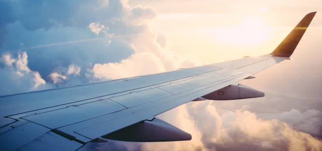 Airplane wing above the clouds